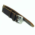 Side view of leather watch strap showing raw edges