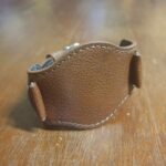 Brown bund leather strap fastened together