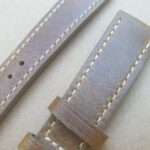 distressed leather watch strap showing leather texture close up