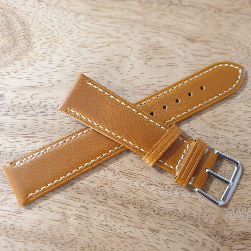 Eudlo Leather Watch Strap Tan with White Edge Stitching placed on top of each other in a cross