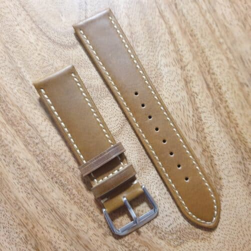 dark tan leather watch strap with white edge stitching