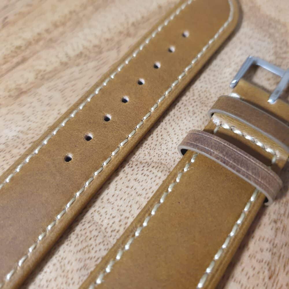 close up of leather watch strap tan colour