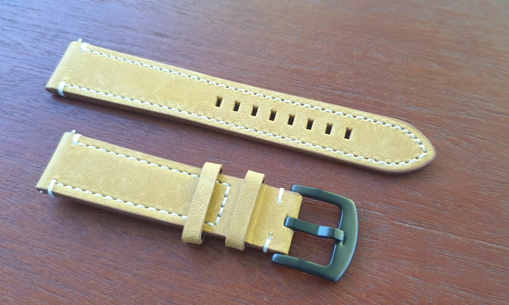 tan leather watch band black buckle