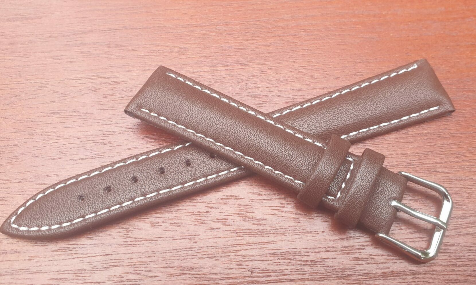 brown leather strap with white thread