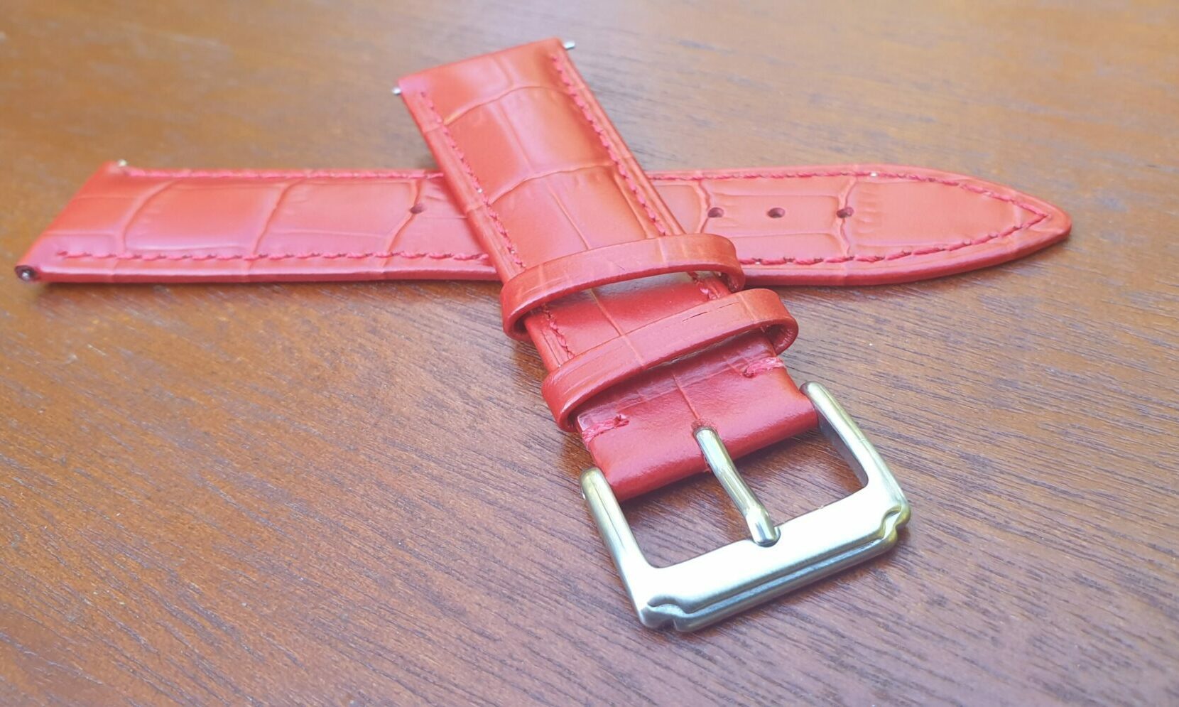 closeup of buckle coolum red leather watch band