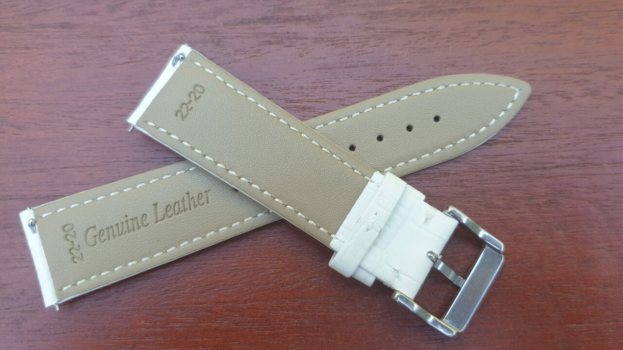 rear of white leather watch band with quick release