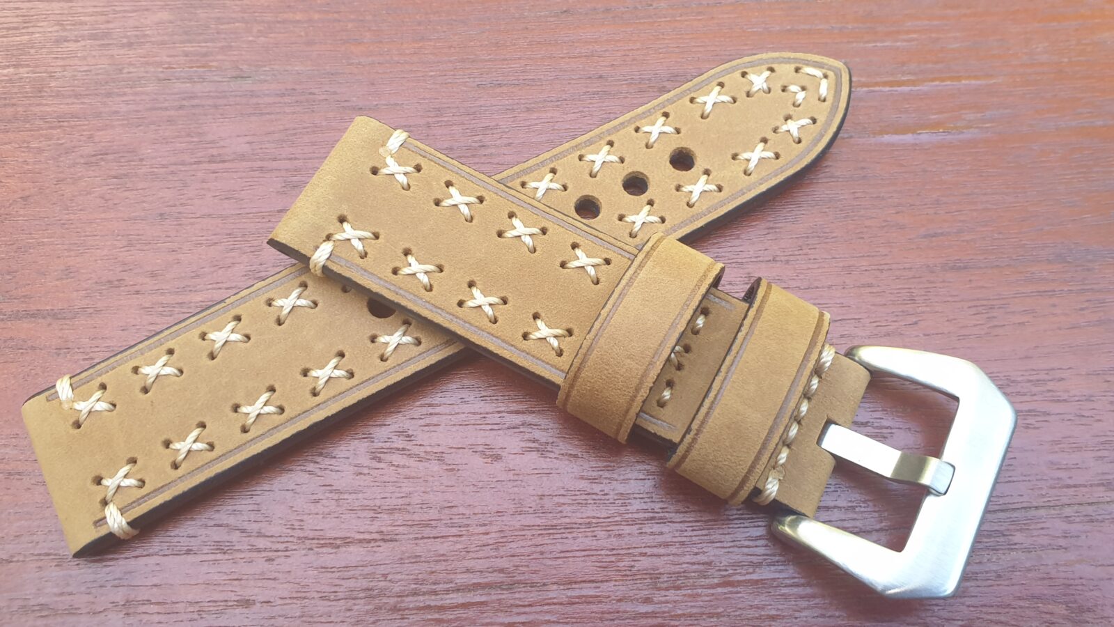 Beige coloured leather watch strap cross stitched