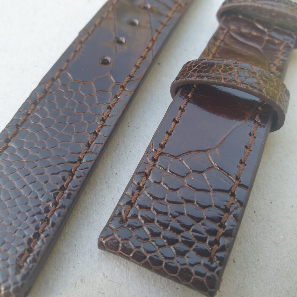 Ostrich Brown watch strap Up Close showing fight marks in skin