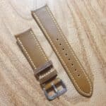 dark tan leather watch strap with white edge stitching