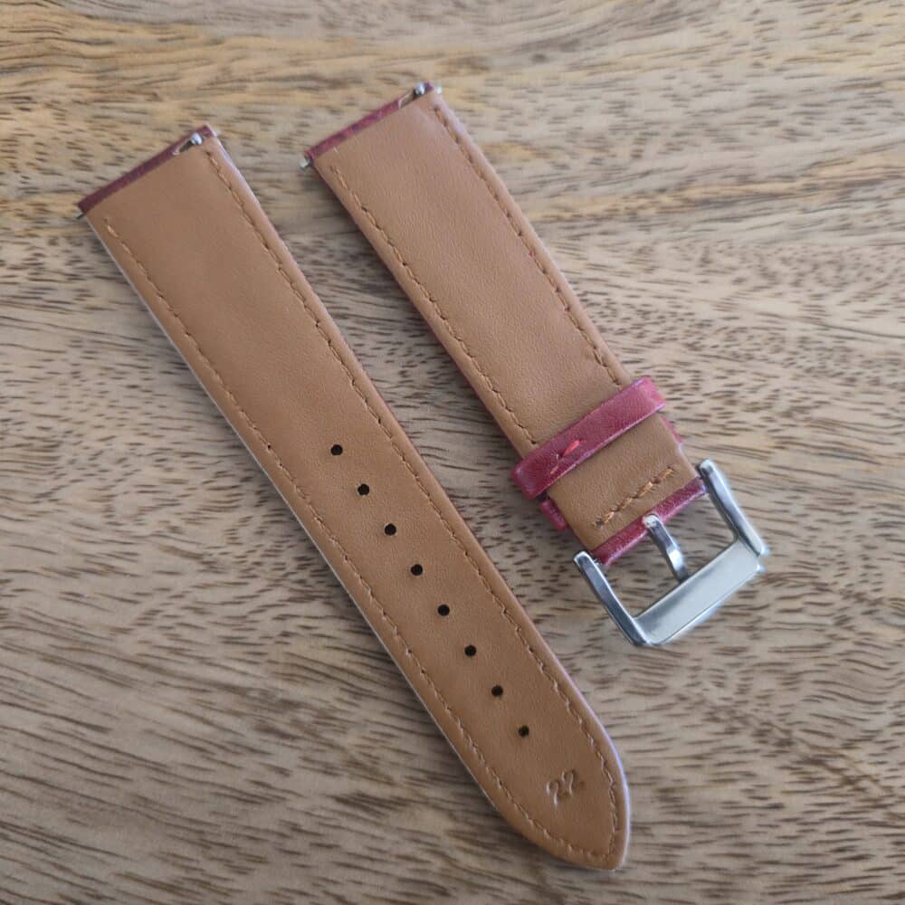 underside of red leather watch strap vintage patina