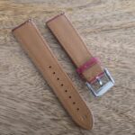 underside of red leather watch strap vintage patina
